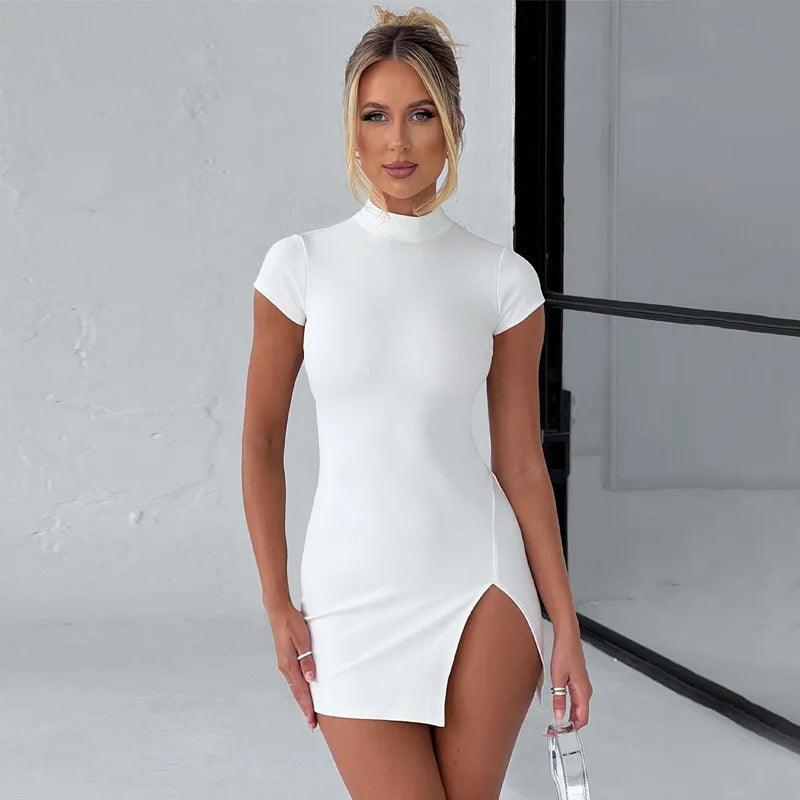 Model wearing a white short sleeve turtle neck mini dress