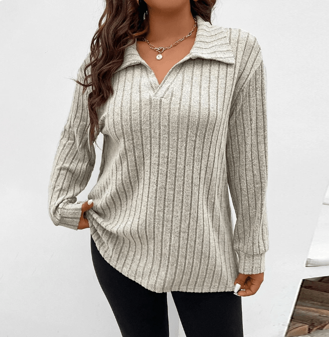 Plus- size model wearing long sleeve collared jumper