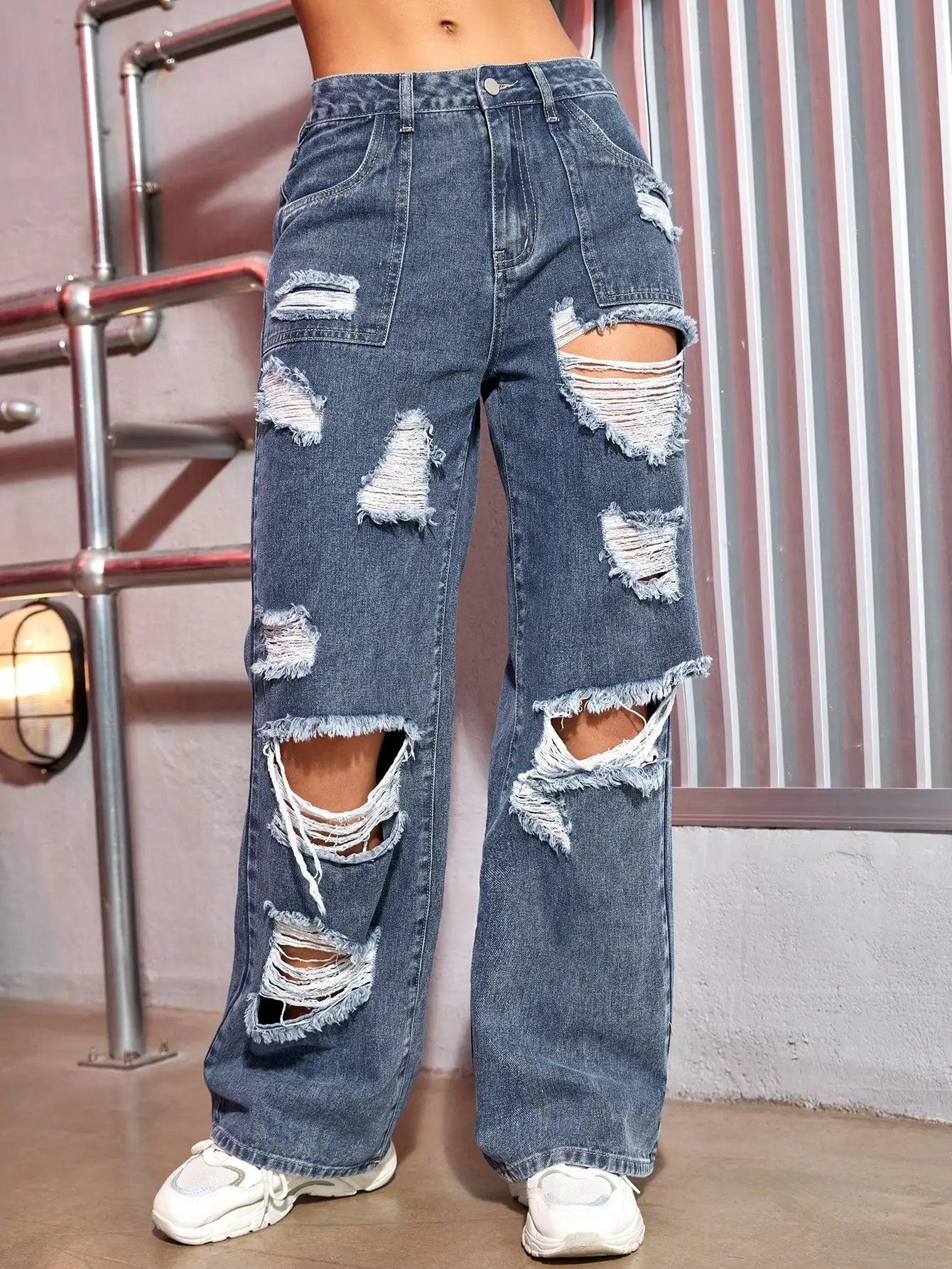 Fashionable ripped blue baggy jeans for women with distressed details and casual fit.