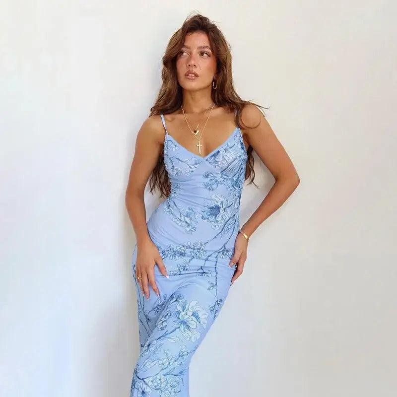 Woman wearing a blue floral bodycon thin strap evening maxi dress